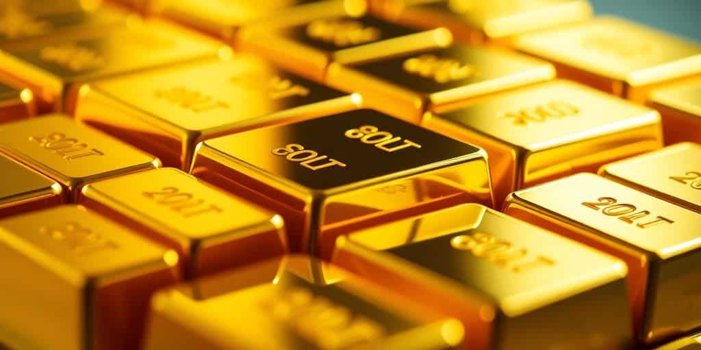 Des barres d'or brillantes empilées.