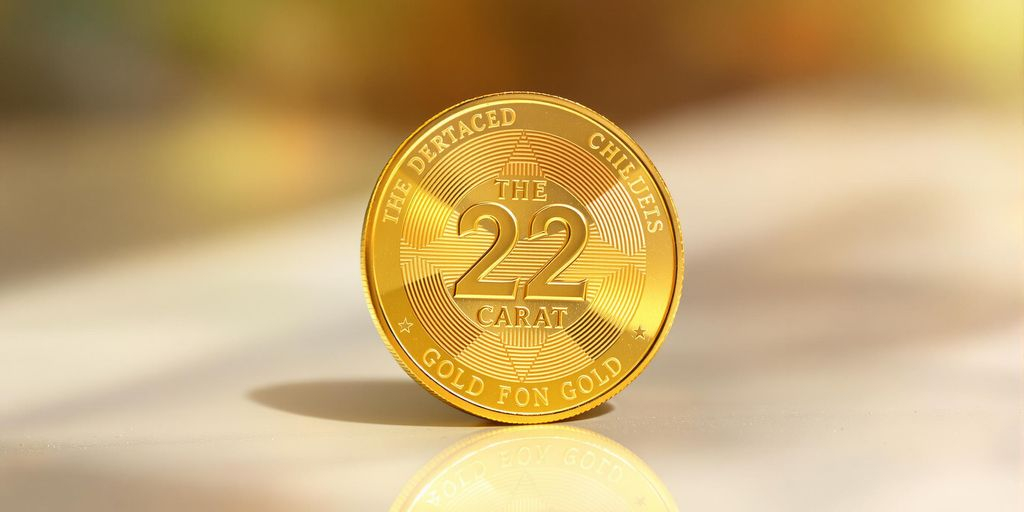 Photo brillante d'une pièce d’or 22 carats aux reflets chauds.