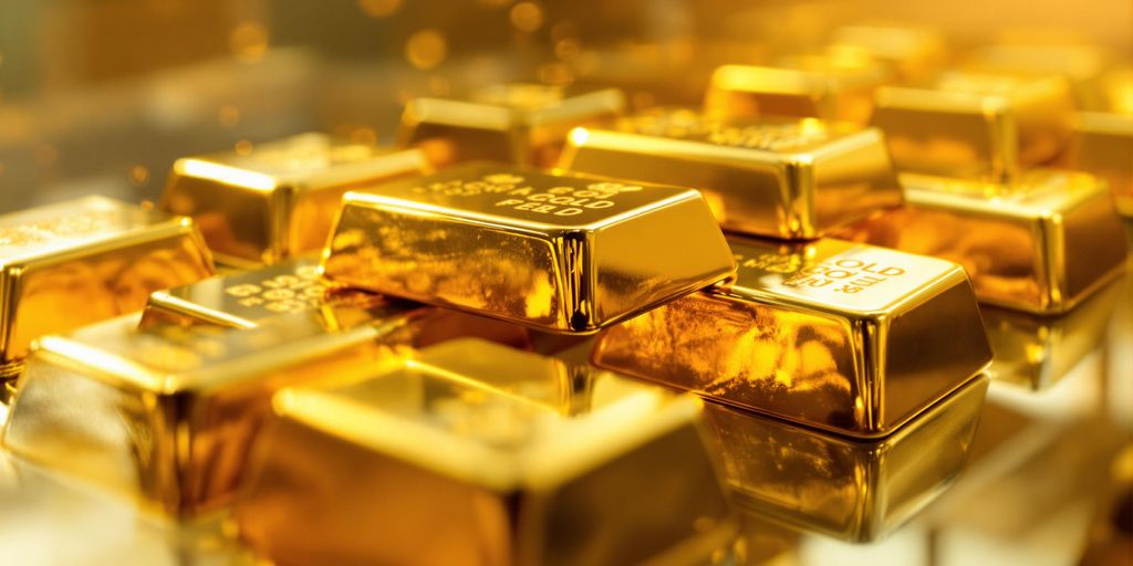 Vue rapprochée de lingots d’or brillants sur surface polie contemporaine