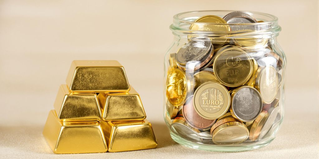 Lingots d'or à côté d'un bocal de pièces euros
