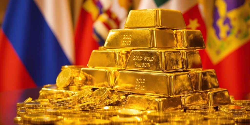 Lingots d'or, pièces et drapeaux des pays