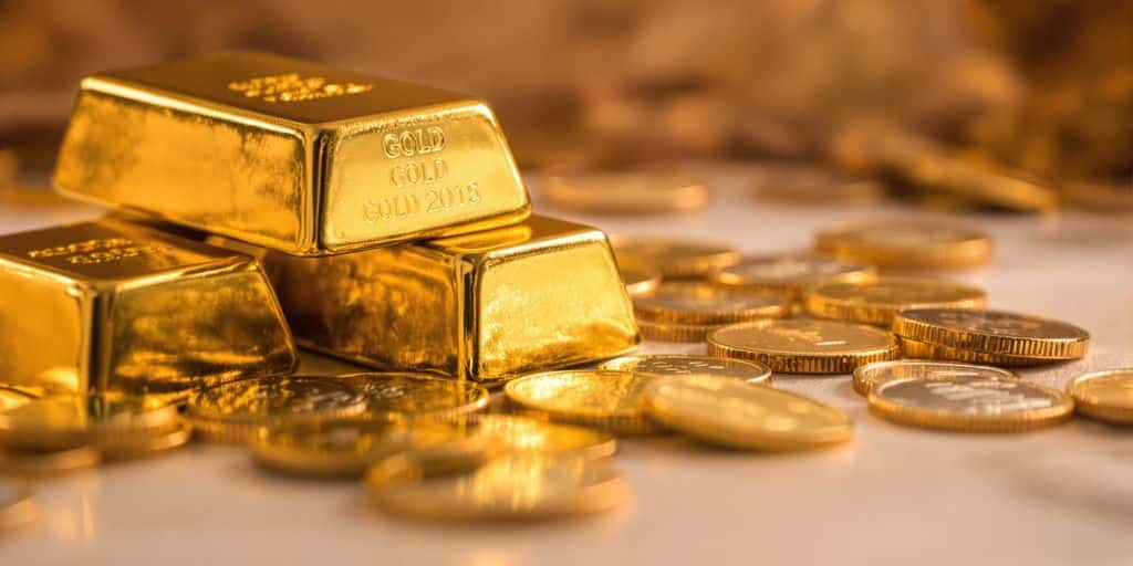 Lingots d'or, pièces d'or, investissement, richesse.