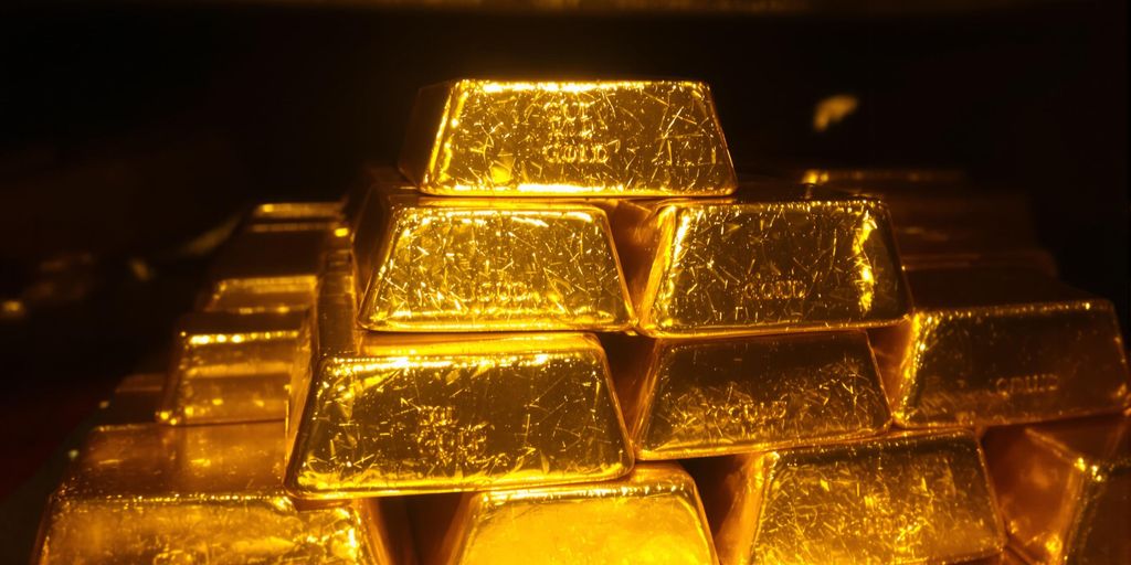 Lingots d'or empilés dans une chambre forte