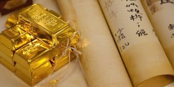 Lingots d'or brillants et parchemins japonais anciens.