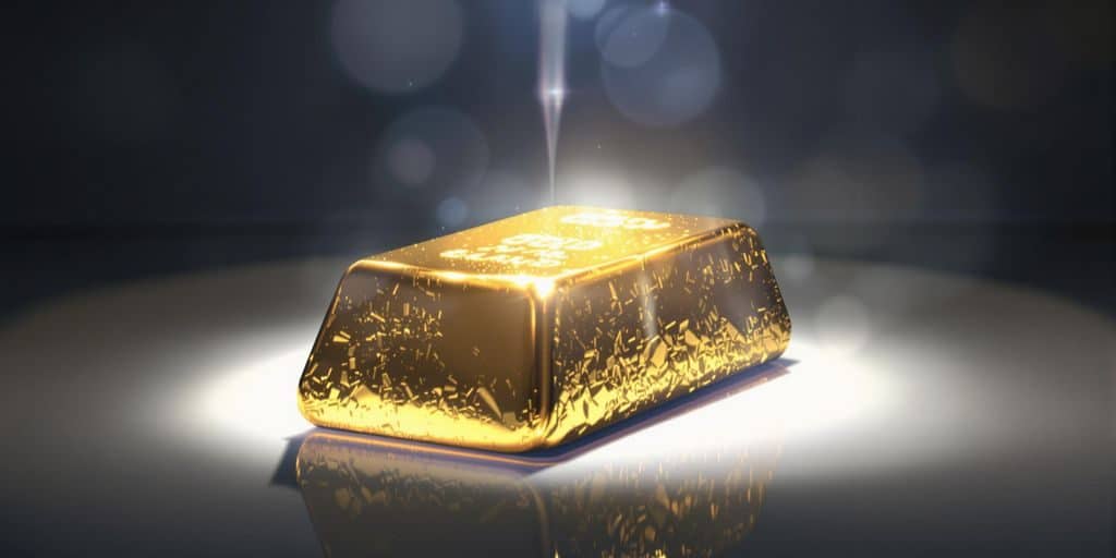 Un lingot d'or pur sous un faisceau de lumière.