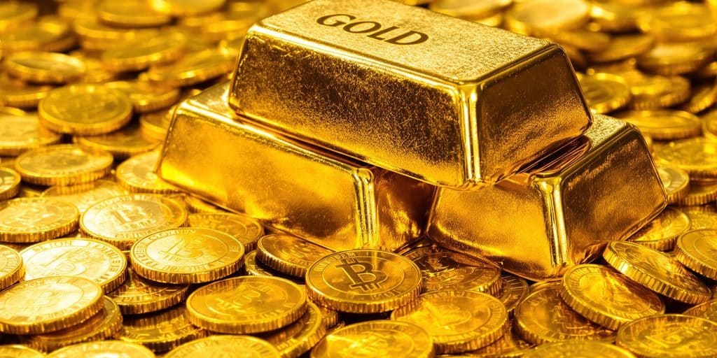 Lingots d'or et pièces d'or sur fond flou