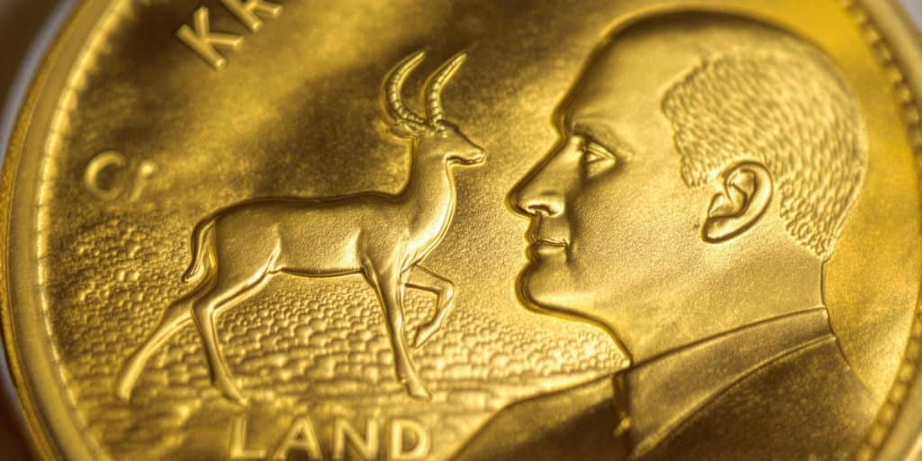 Un Krugerrand doré, gros plan sur le Springbok.